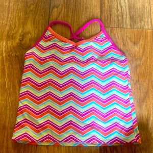 A top to a pink, orange, yellow and blue swim suit. Size 7 girls.